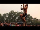 Exciting game oiled pole climbing -At the 50th Naga Fest'13