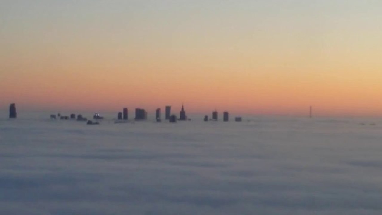Aerial View Captures Skyscrapers Amid Fog in Warsaw
