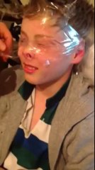 Man Wraps His Brother's Head in Sellotape