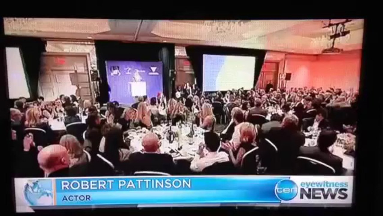 Robert Pattinson presenting the award to Blue Tongue Films