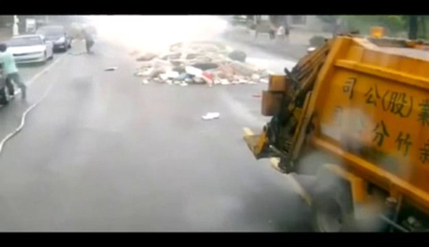 Explosion of wastes in the middle of the street. Smoky...