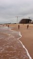 Boys dancing on the beach