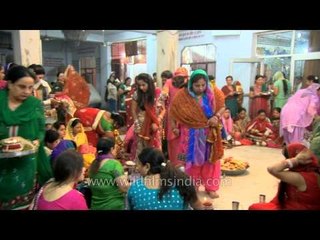 Women performing Karva Chauth rituals in Delhi