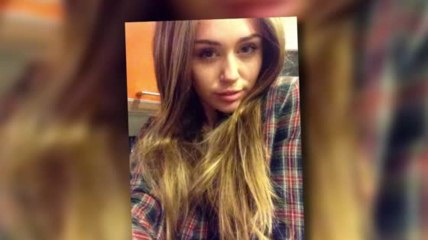 Miley Cyrus Sports a Long Brown Wig For Halloween