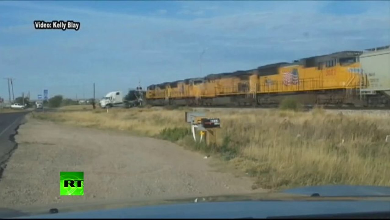 'Holy Smokes!' Train collides with truck stuck on tracks