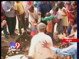 Madhya Pradesh : Watch how innocent kids are thrown in cow dung for tradition sake - Tv9 Gujarat