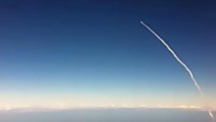 Space Shuttle launch viewed from airplane