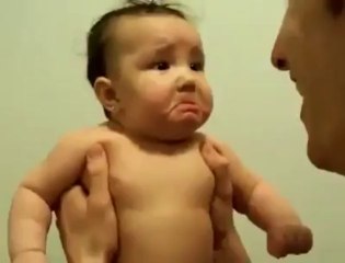 scaring a little baby with laughing