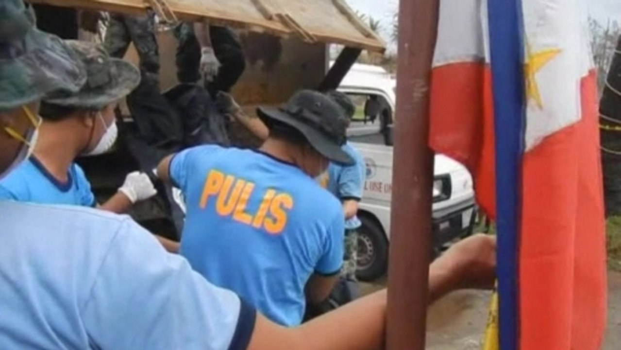 Philippine forensic workers begin identifying typhoon victims