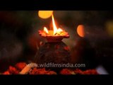 Lit lamps as part of religious ritual - Chhath celebrations on a bank of Yamuna river