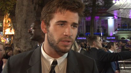 Liam Hemsworth Gets His Hair Wet At "The Hunger Games" Premiere