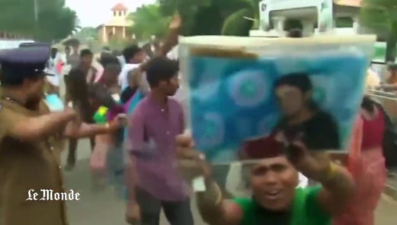 Le convoi de David Cameron pris d'assaut par de nombreux Tamouls