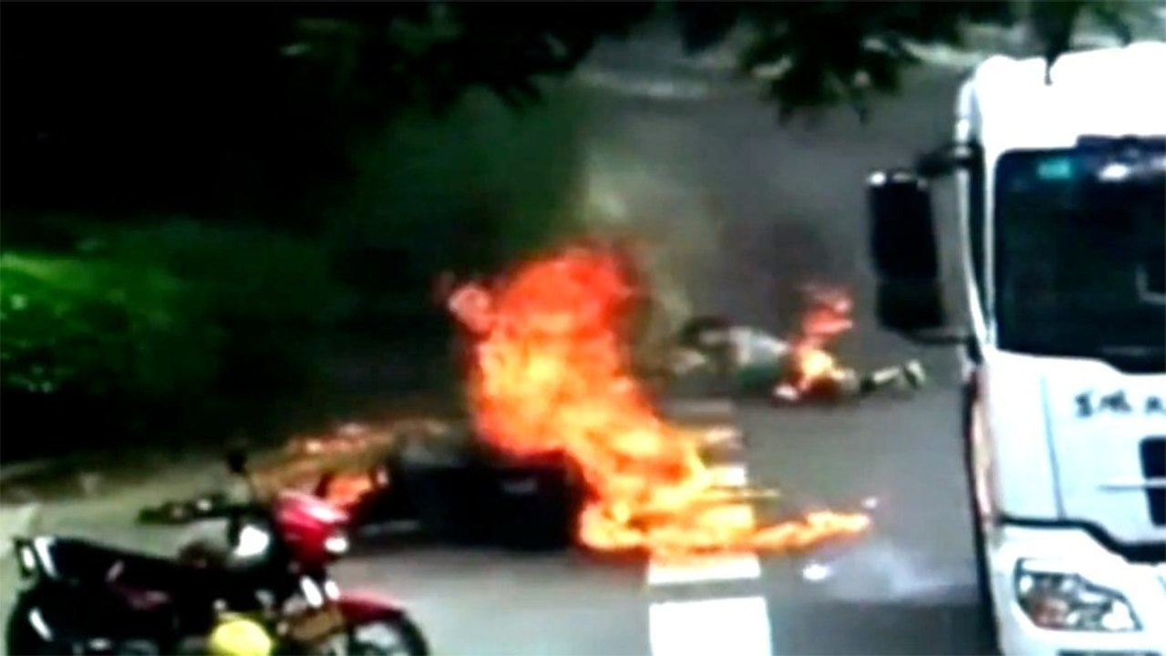 Woman Survives Insane Fireball Bike Crash