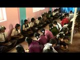 Primary school children receiving Midday Meal in Karnataka