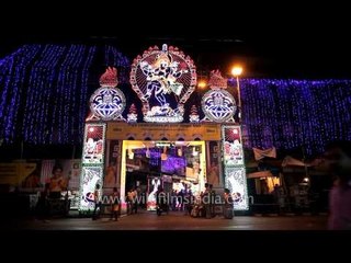 Rush outside a decorated Durga Puja pandal