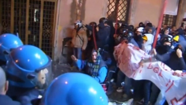 Italian riot police and demonstrators clash
