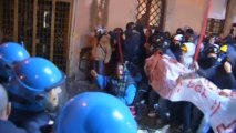 Italian riot police and demonstrators clash