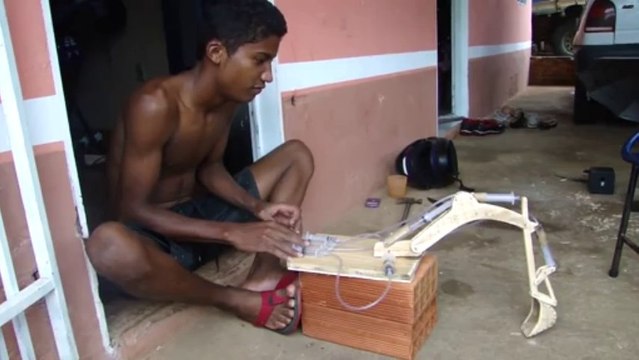 Built his own toys : excavator with syringues.