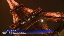 Eiffel Tower lights up for 'Paris Climat 2015'