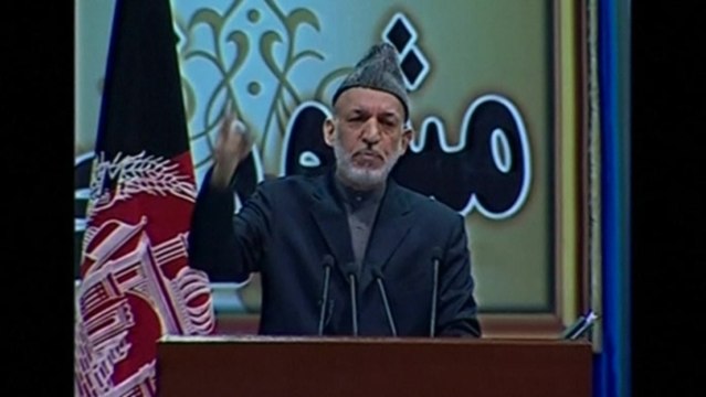 Afghan elders endorse U.S. security deal as Karzai remains uncertain