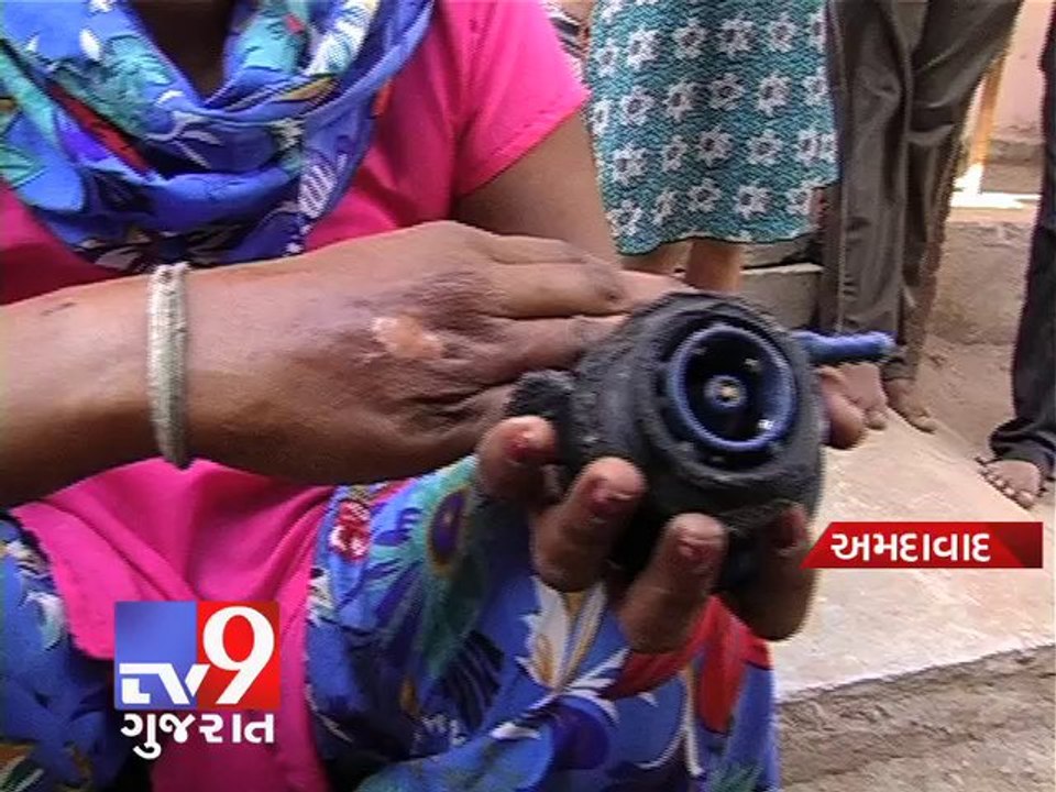 Brave woman throws burning gas cylinder out of...