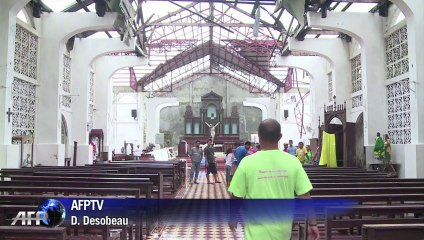 US aid helps Filipino town forget church bell grudge