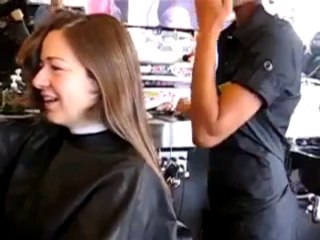 haircut on women chopping of her ponytail