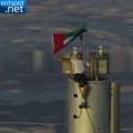 Sheikh Hamdan waves UAE flag from top of Burj Khalifa