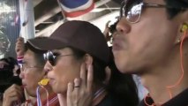 Thai office workers whistle in protest