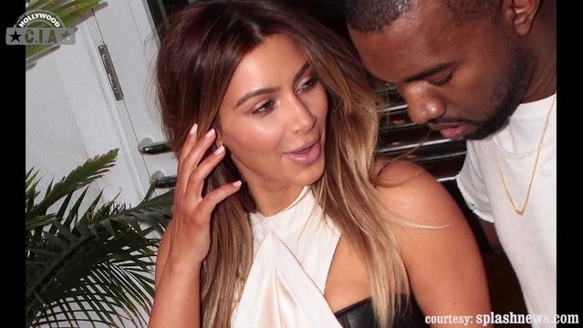 Kim Kardashian and Kanye West Caught Getting Cozy In Public