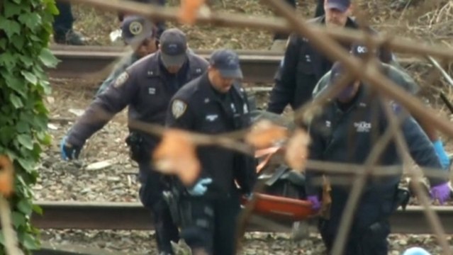 Rescue crews begin removing bodies from NYC train derailment