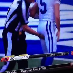 NFL referee giving a little bit extra