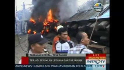Train collides with truck in Indonesia, four dead.