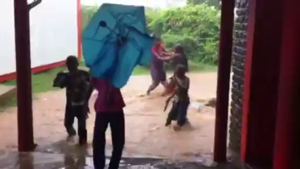 Kids playing in the rain