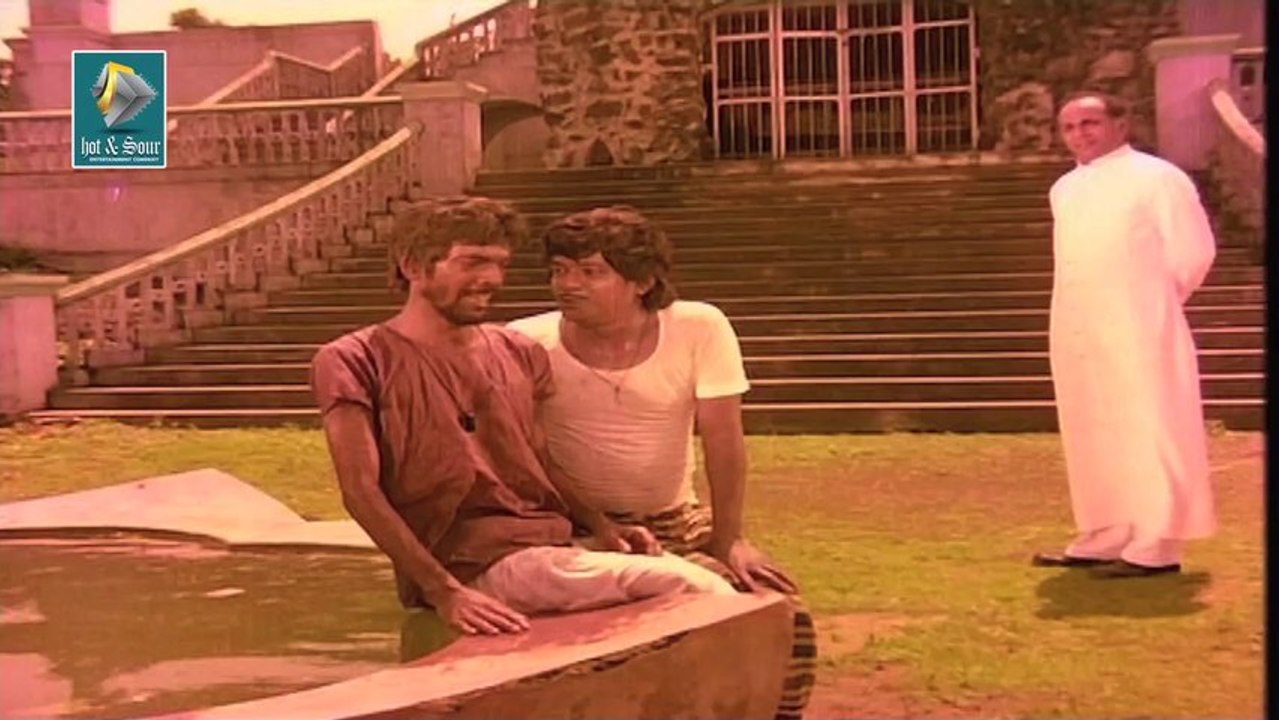 Malayalam Dramatic Movie Aaraattu -  Chackochan hurting wife with Cigar