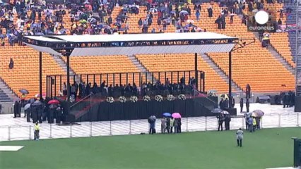 World leaders and the rain descend on Mandela's memorial service
