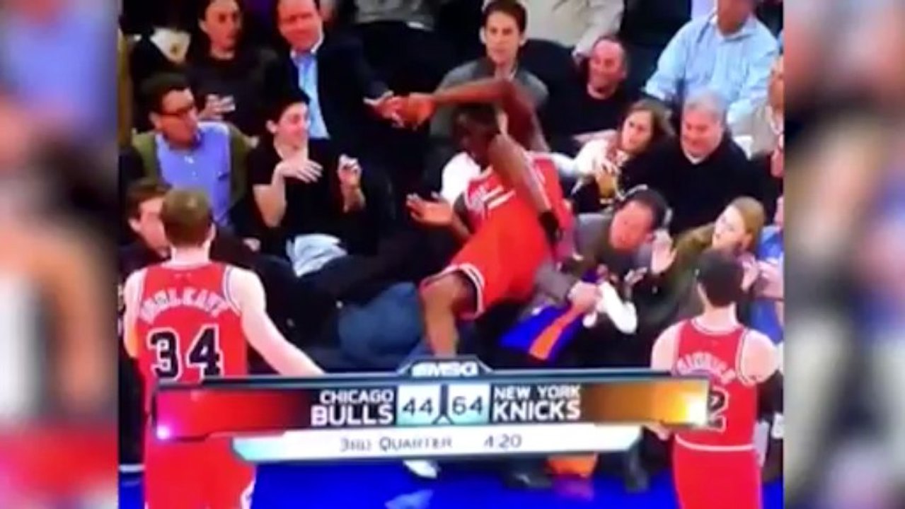 Un fan sauve une fillette du saut d'un joueur des Chicago bulls !!