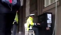 Policeman playing piano in Prague - Coolest cop ever!!!