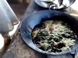 crazy man put hands into boiling oil
