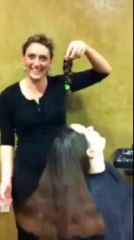 haircut of long haired brunette braid chopped off