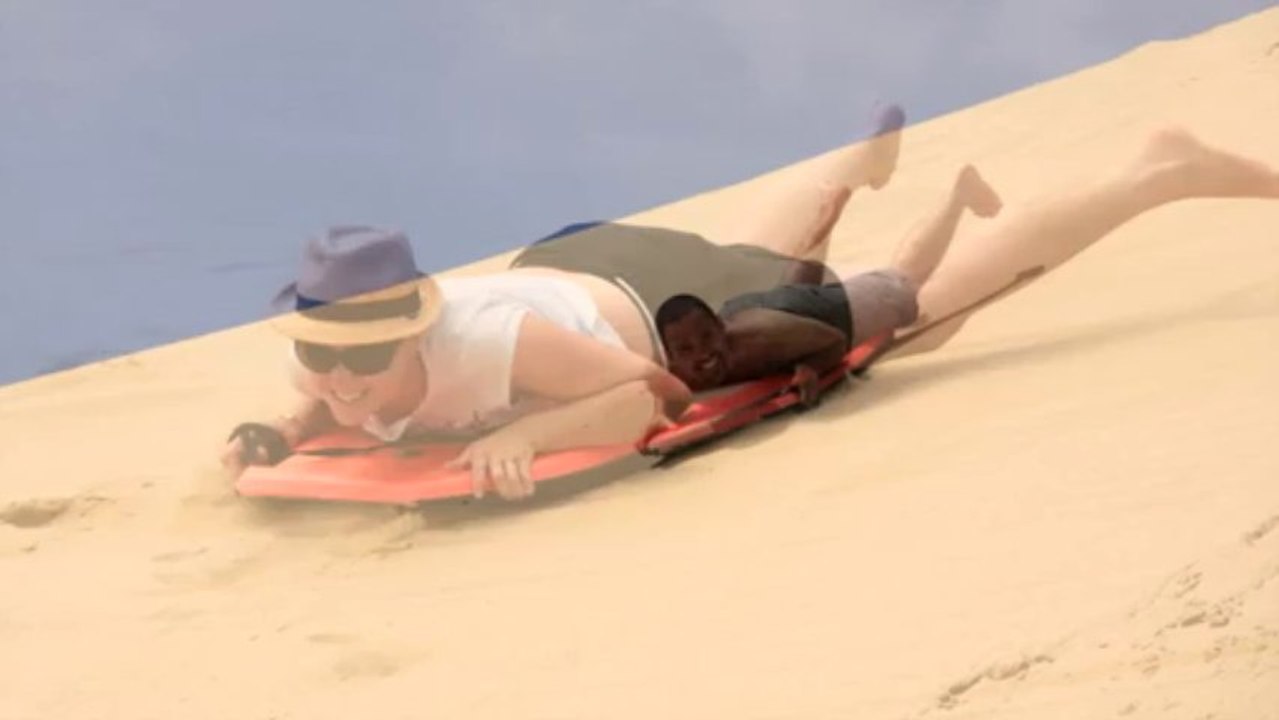 Sand surfing Te Paki