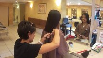 cute girl cuts off two ponytails