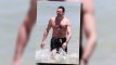 Hugh Jackman Takes a Shirtless Swim in Australia