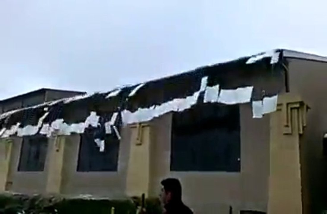 Amazing  snow avalanche falling from a roof!