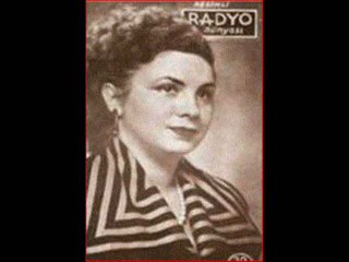 MELEK TOKGÖZ   -   (TAŞ PLAK)GÖĞSÜNDE AÇILMIŞ İKİ GONCAYLA BAHARSIN