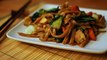 Cooking a Thai dish in Thailand, Pad see ew. stir fried rice noodle dish.
