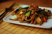 Cooking a Thai dish in Thailand, Pad see ew. stir fried rice noodle dish.
