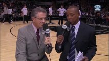 Tim Duncan pushing an unsuspecting TV announcer off his chair