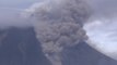 Indonesian volcano erupts, forces more residents to flee