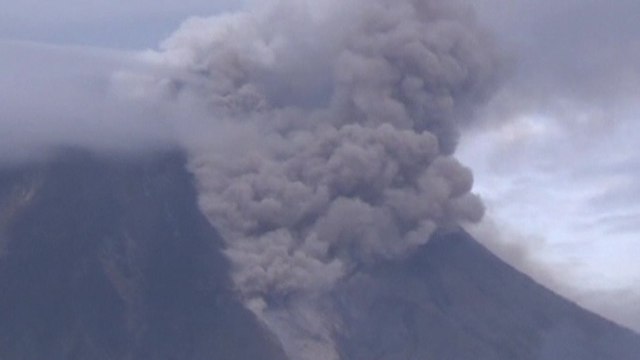 Indonesian volcano erupts, forces more residents to flee